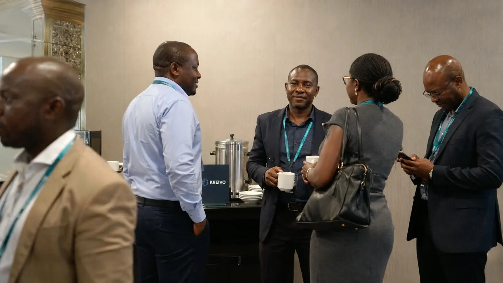 Participants networking during a break at a Kreivo programme