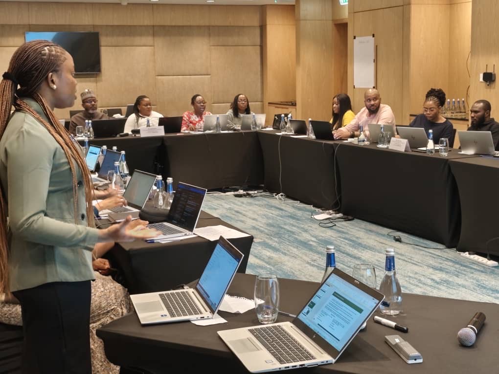 Modern training room with participants learning from an expert facilitator